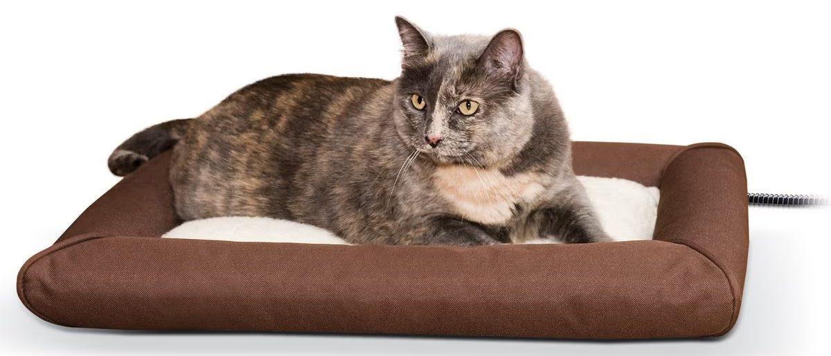 Heated dog bed with fleece cover and bolster.