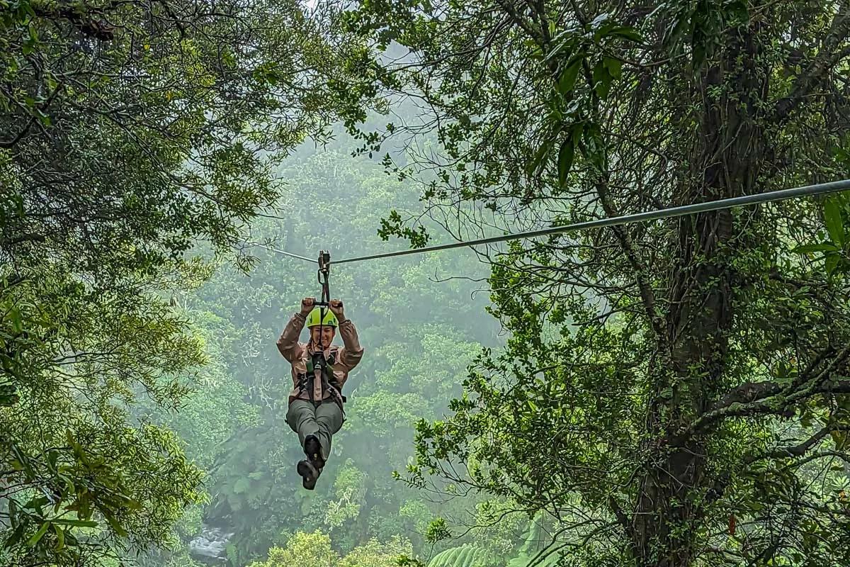 Woman ziplining in Cancun, Mexico, booked through Viator